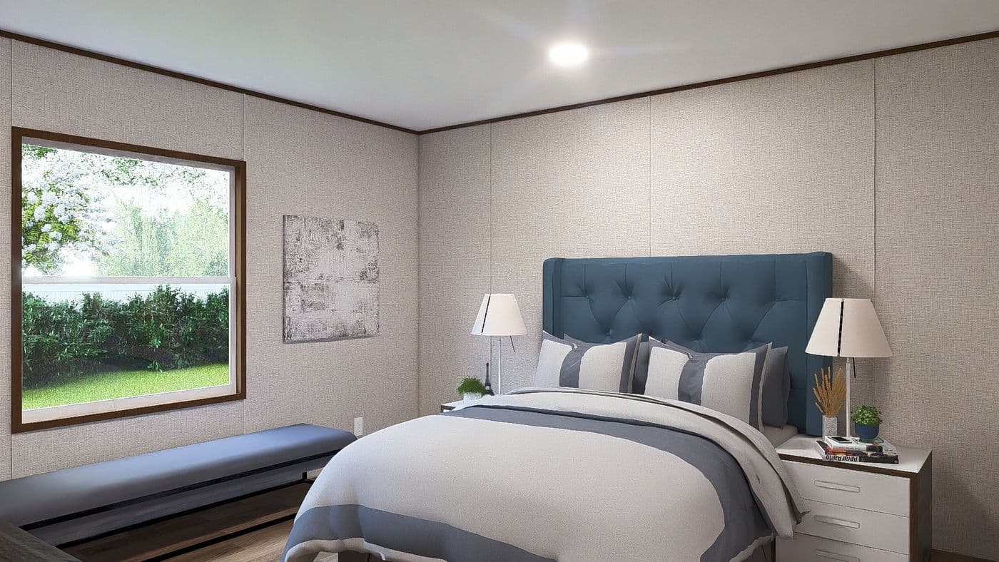 The MAPLE Primary Bedroom. This Manufactured Mobile Home features 3 bedrooms and 2 baths.