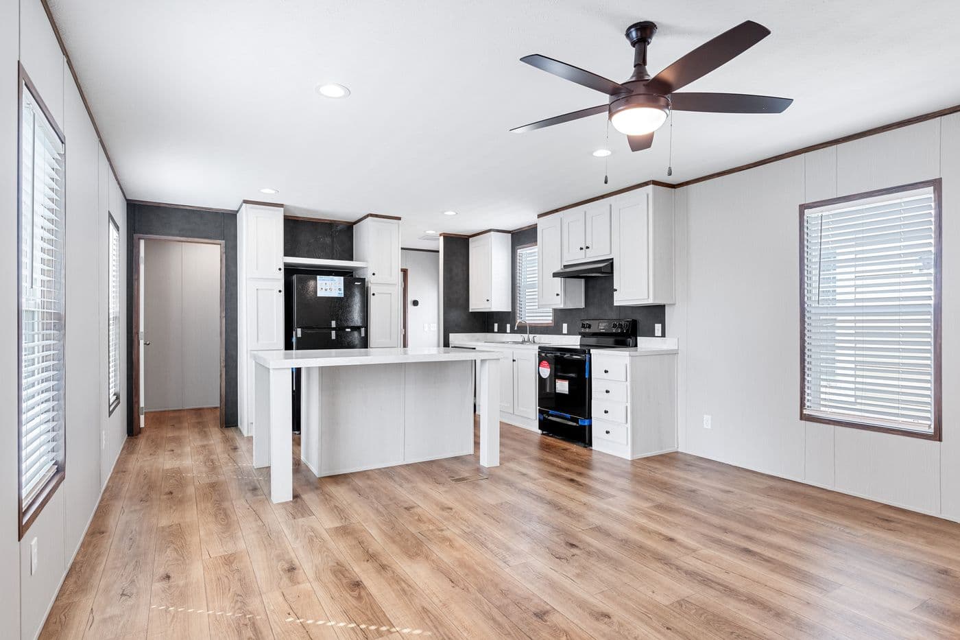 The HOMESTEAD 16683A Kitchen. This Manufactured Mobile Home features 3 bedrooms and 2 baths.