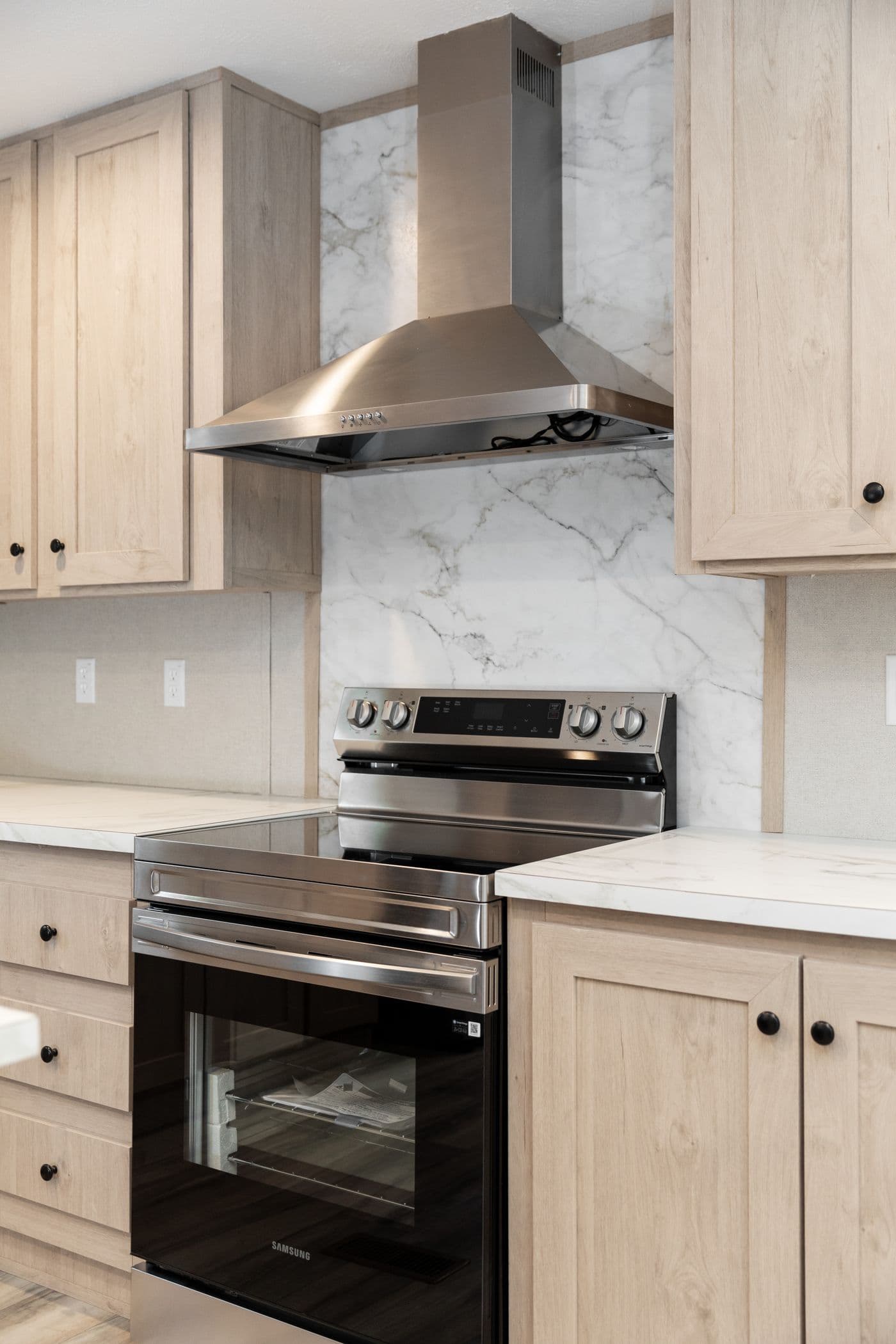 The THE ANNIVERSARY ISLANDER Kitchen. This Manufactured Mobile Home features 3 bedrooms and 2 baths.