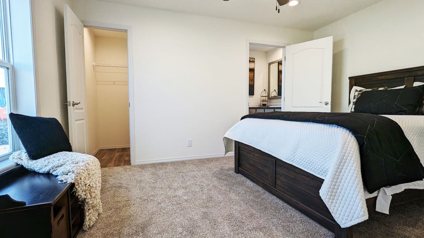 The RAMSEY 216-2 Primary Bedroom. This Manufactured Mobile Home features 3 bedrooms and 2 baths.