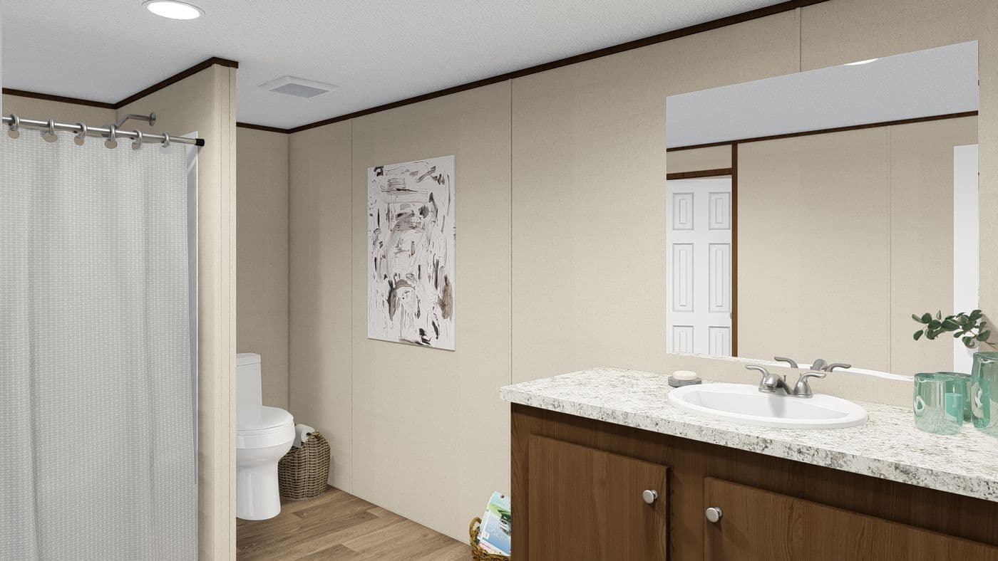 The THRILL Primary Bathroom. This Manufactured Mobile Home features 3 bedrooms and 2 baths.