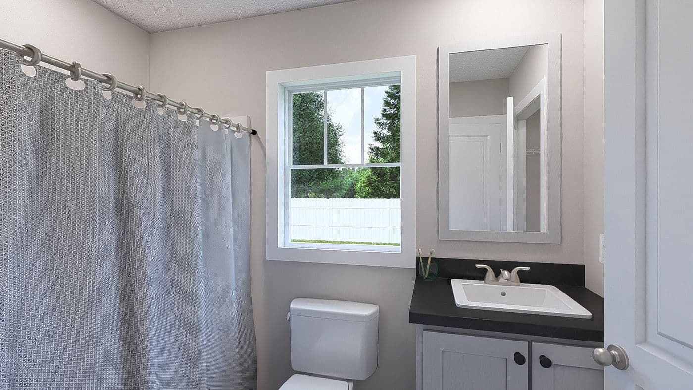 The YESTERDAY Guest Bathroom. This Manufactured Mobile Home features 1 bedroom and 1 bath.
