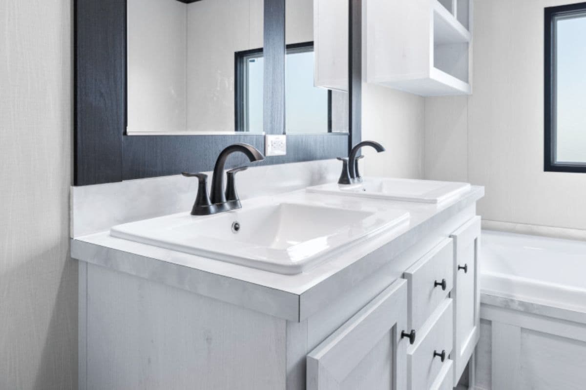 The ANNIVERSARY 16763S Primary Bathroom. This Manufactured Mobile Home features 3 bedrooms and 2 baths.