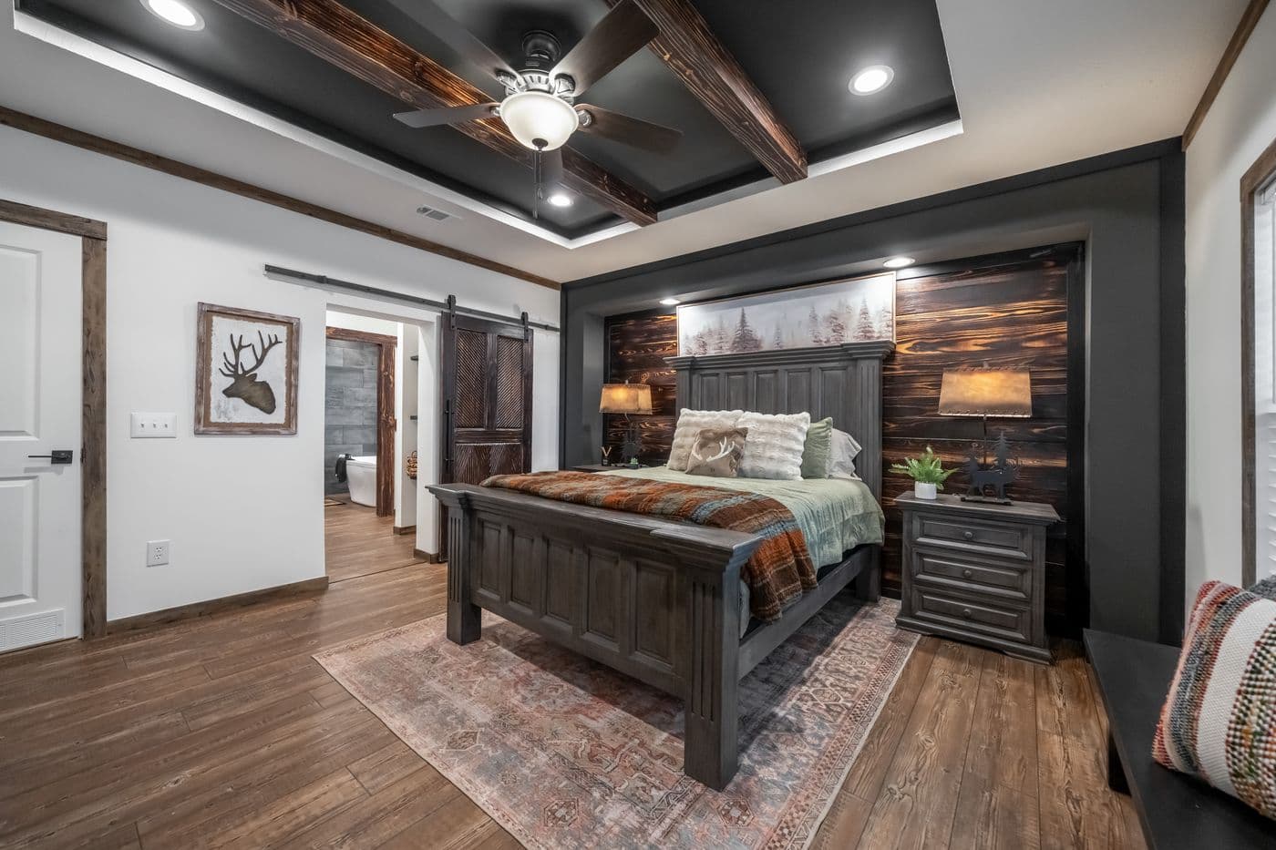 The THE MILL HOUSE Primary Bedroom. This Manufactured Mobile Home features 3 bedrooms and 2 baths.