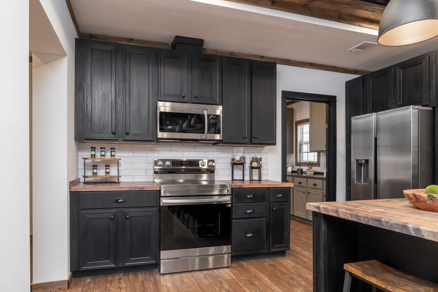 The THE MILL HOUSE Kitchen. This Manufactured Mobile Home features 3 bedrooms and 2 baths.