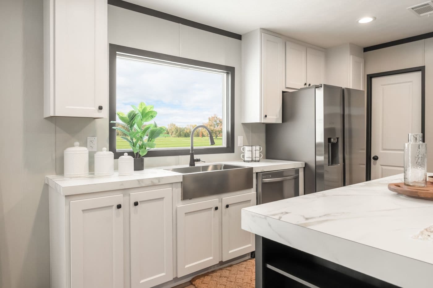 The THE ANNIVERSARY 2.1 Kitchen. This Manufactured Mobile Home features 3 bedrooms and 2 baths.