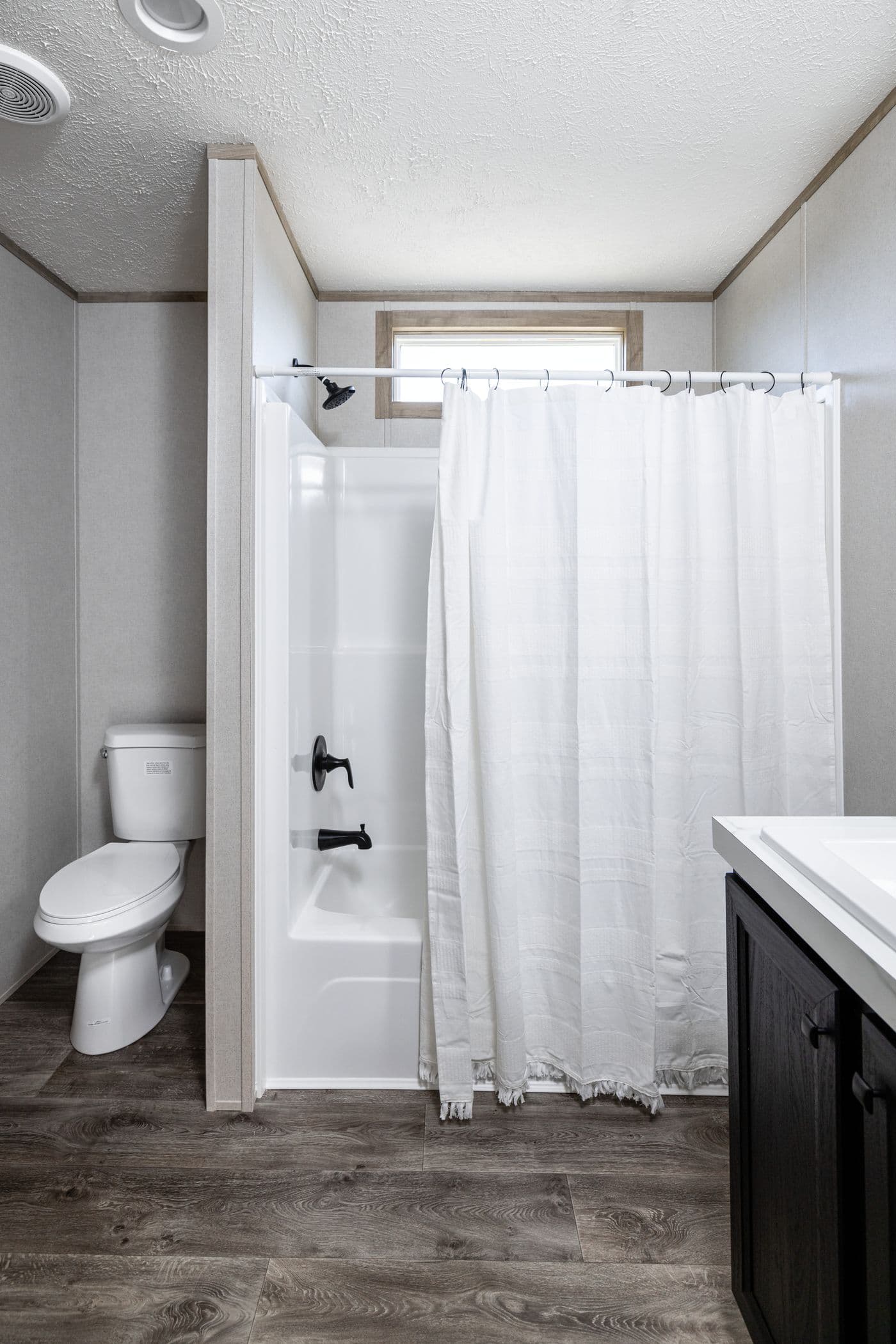 The STERLING ANNIVERSARY Guest Bathroom. This Manufactured Mobile Home features 3 bedrooms and 2 baths.