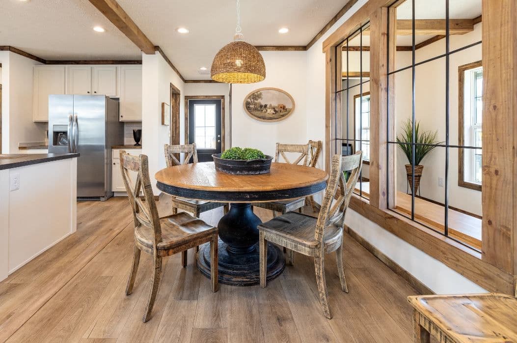 The ARABELLA Dining Room. This Manufactured Mobile Home features 3 bedrooms and 2 baths.