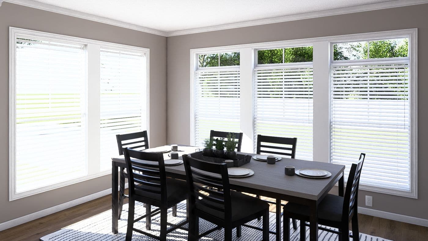 The THE ABIGAIL II Dining Room. This Manufactured Mobile Home features 3 bedrooms and 2 baths.