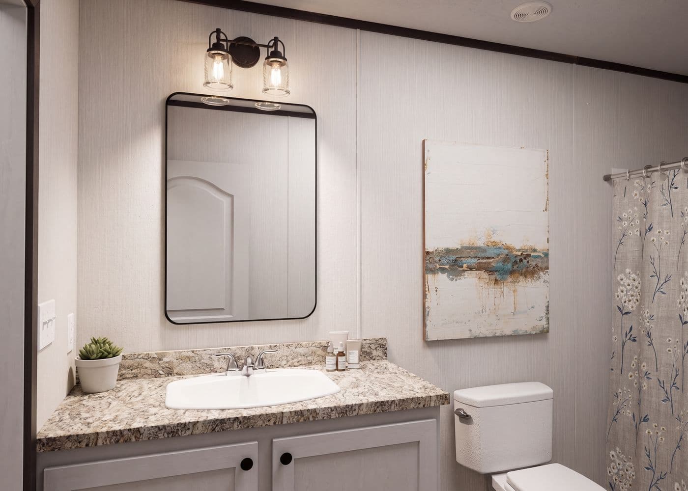 The THE FUSION 32H Guest Bathroom. This Manufactured Mobile Home features 5 bedrooms and 3 baths.