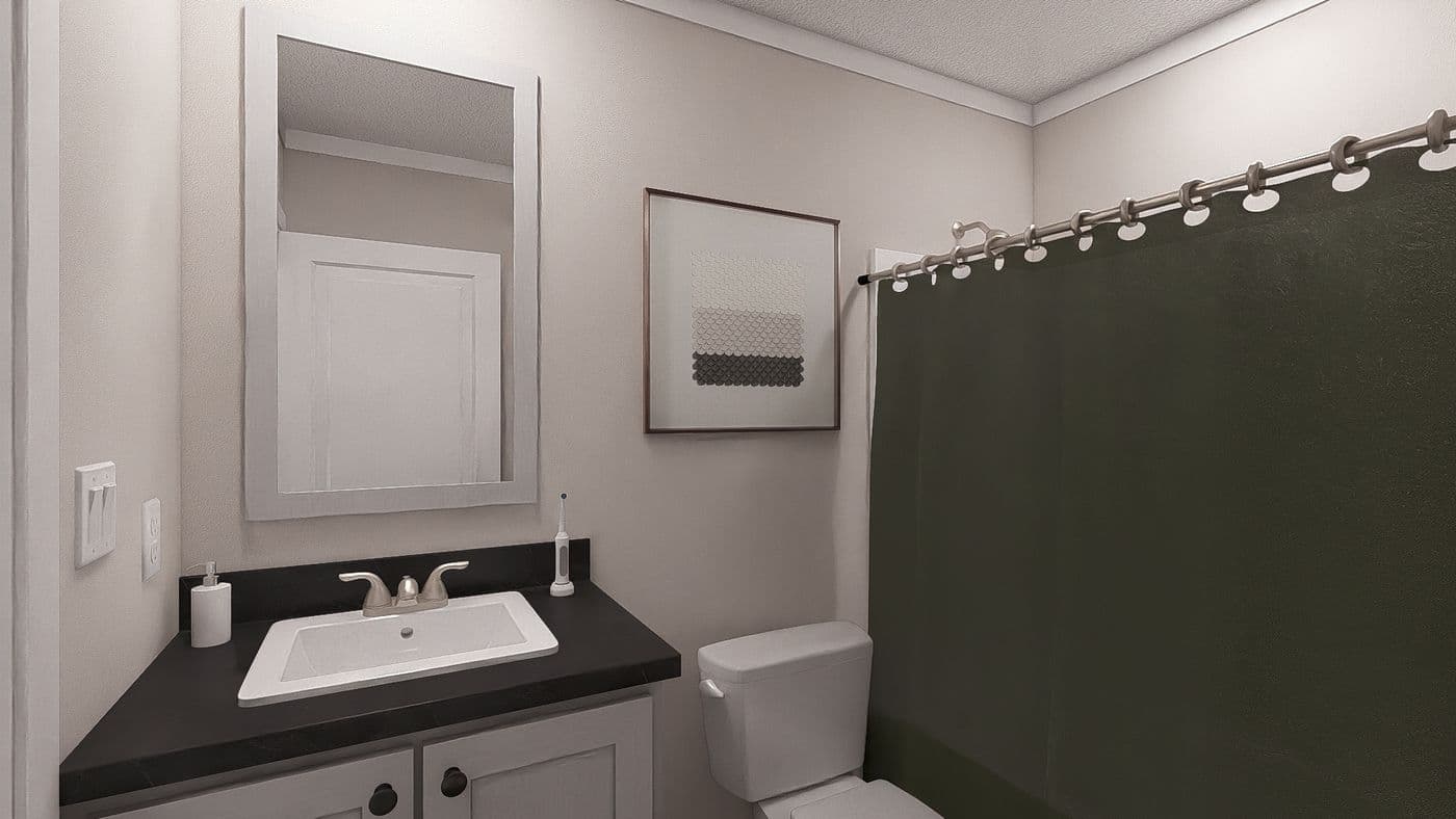 The UNDER PRESSURE Guest Bathroom. This Manufactured Mobile Home features 3 bedrooms and 2 baths.