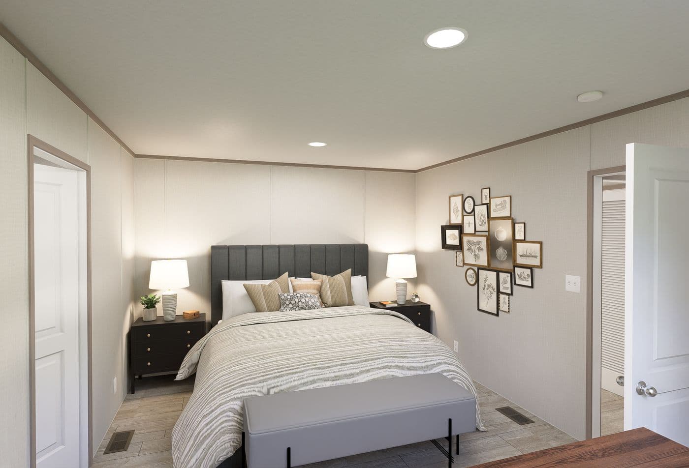 The FLEX ANNIVERSARY Primary Bedroom. This Manufactured Mobile Home features 3 bedrooms and 2 baths.
