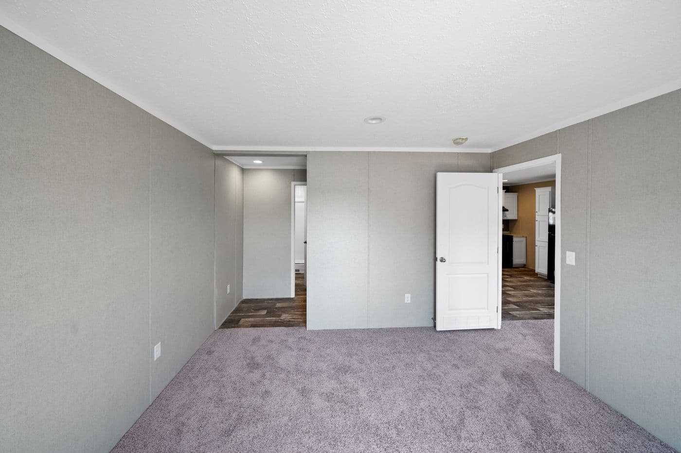 The ZIRCON Primary Bedroom. This Manufactured Mobile Home features 3 bedrooms and 2 baths.