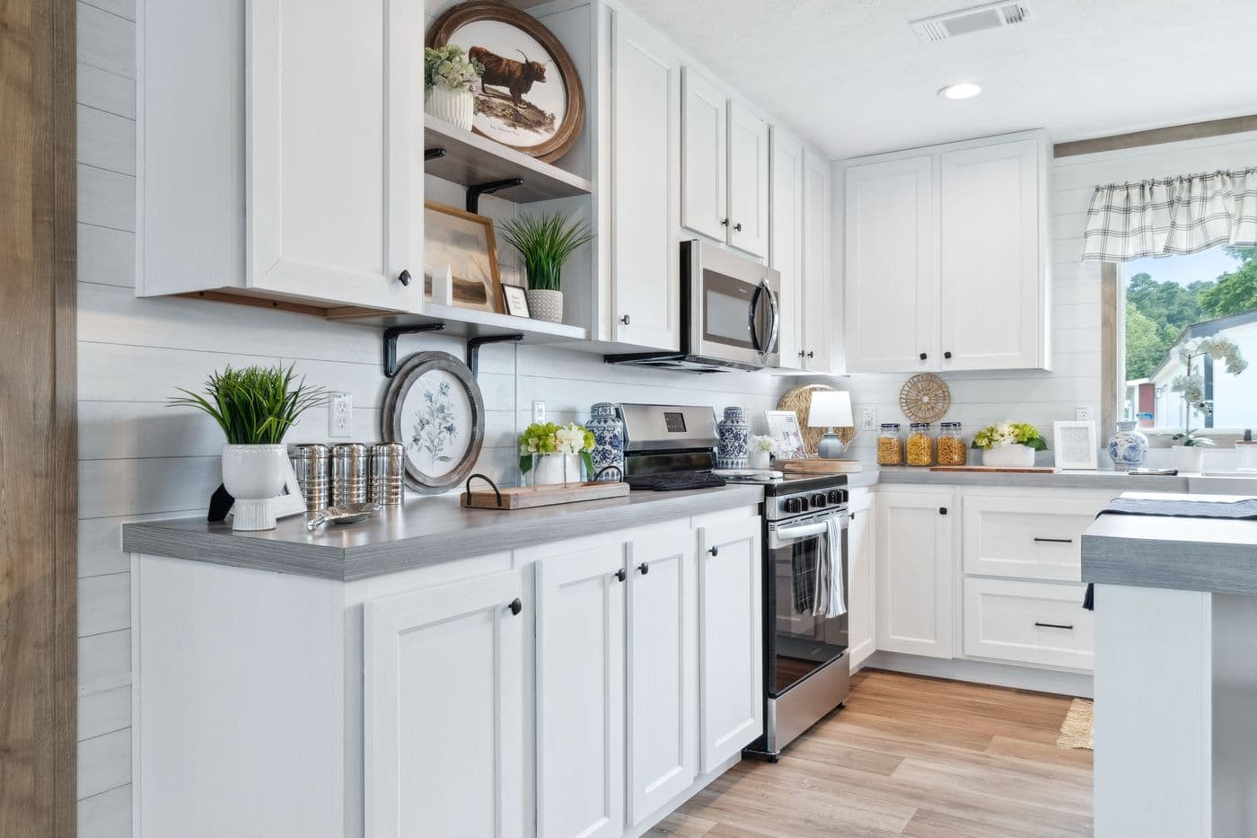 The BREEZE FARMHOUSE 72 Kitchen. This Manufactured Mobile Home features 4 bedrooms and 2 baths.