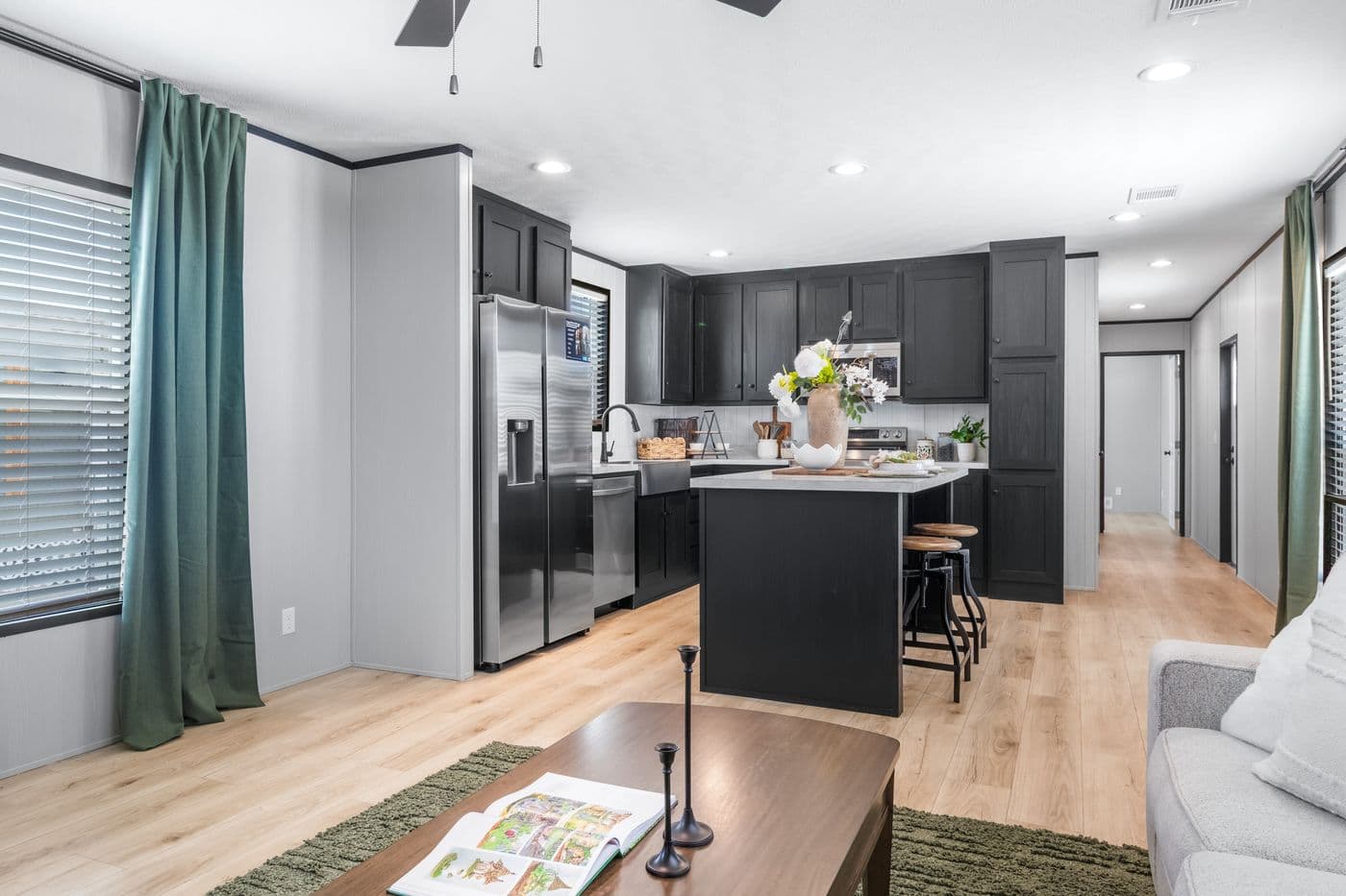 The RESOLUTION 16803B Living Room. This Manufactured Mobile Home features 3 bedrooms and 2 baths.