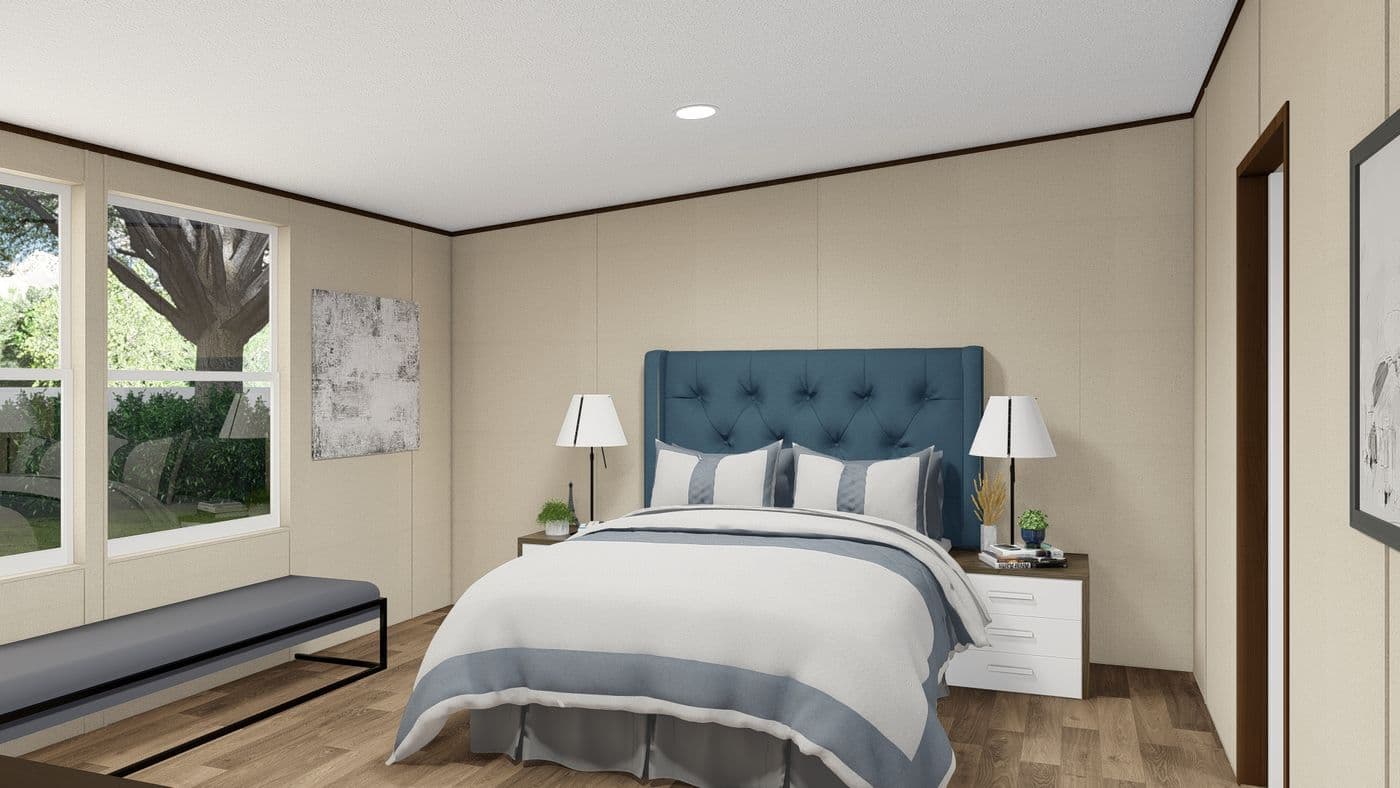 The MARVEL Primary Bedroom. This Manufactured Mobile Home features 4 bedrooms and 2 baths.