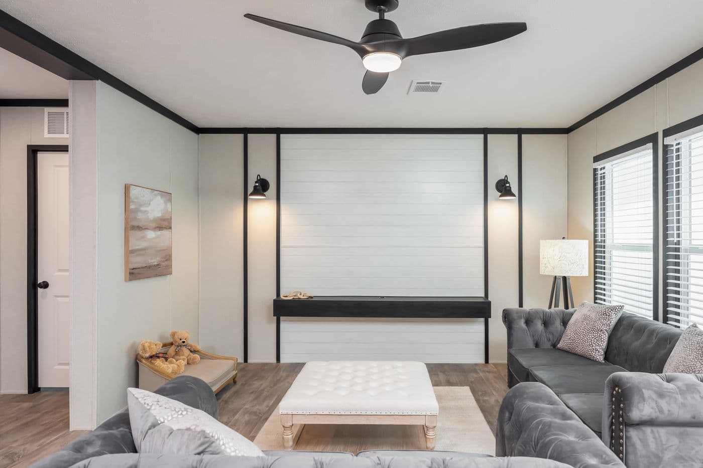 The BREEZE FARMHOUSE Living Room. This Manufactured Mobile Home features 3 bedrooms and 2 baths.