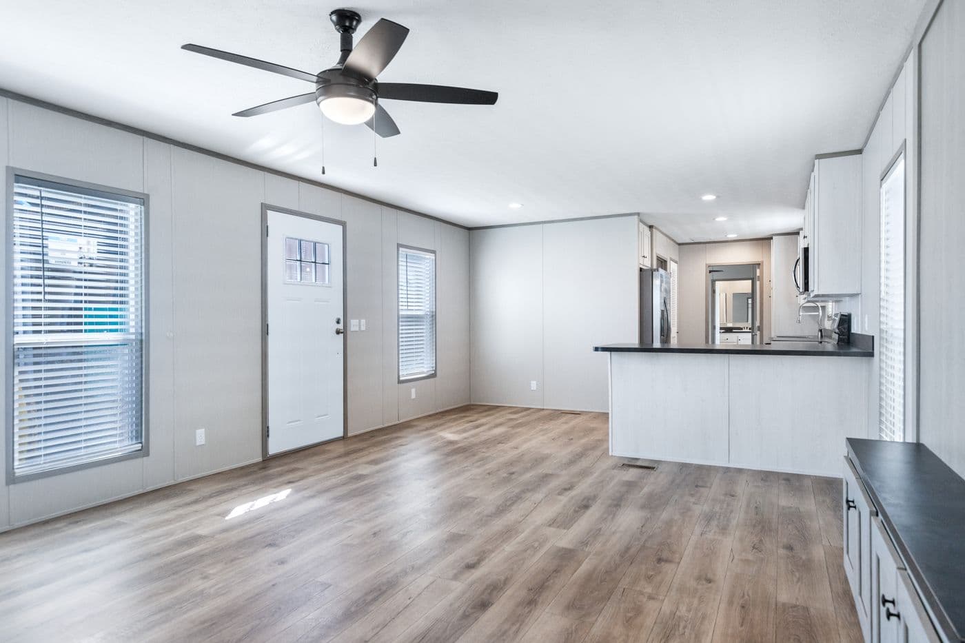 The RESOLUTION 16763K Living Room. This Manufactured Mobile Home features 3 bedrooms and 2 baths.
