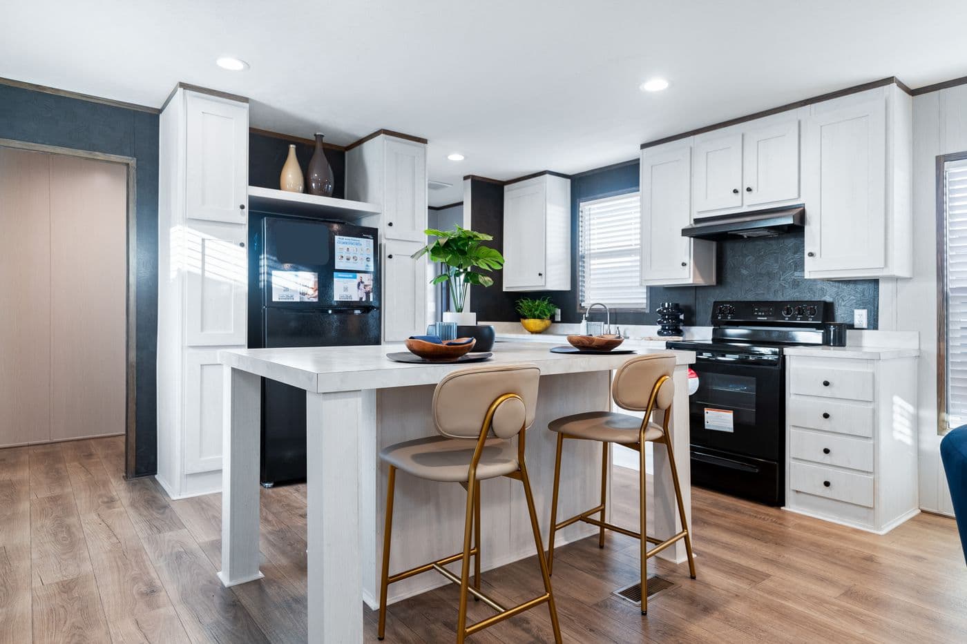 The HOMESTEAD 16763A Kitchen. This Manufactured Mobile Home features 3 bedrooms and 2 baths.