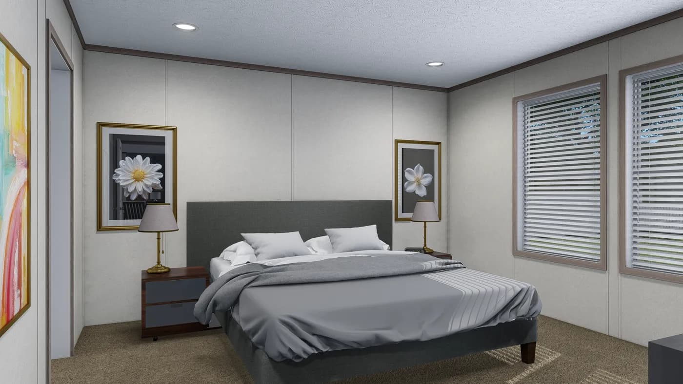 The 6428-E792 THE PULSE Primary Bedroom. This Manufactured Mobile Home features 3 bedrooms and 2.5 baths.