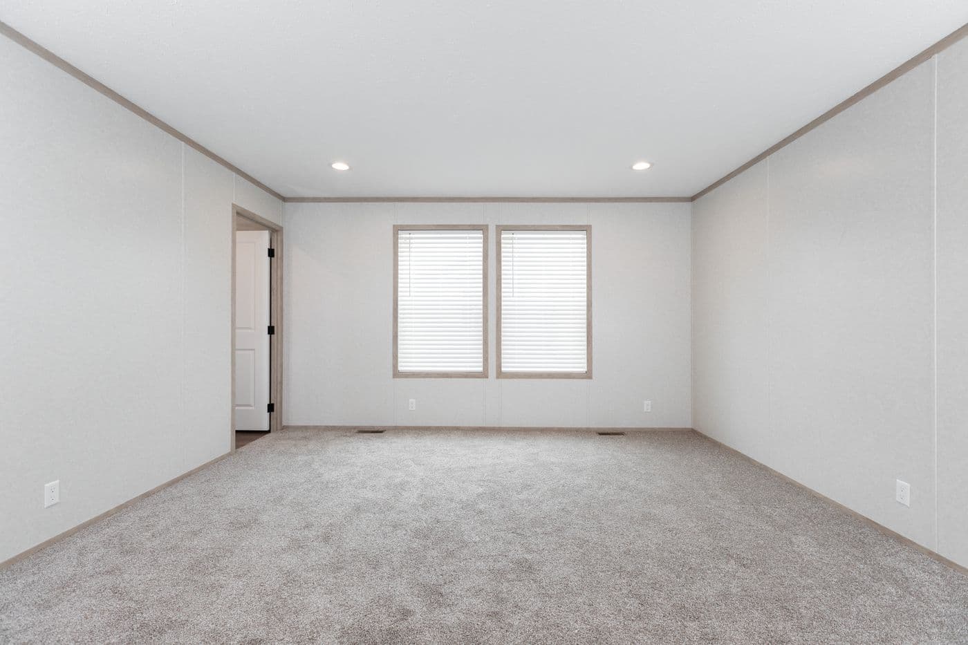 The 6032-5700 THE PULSE Primary Bedroom. This Manufactured Mobile Home features 3 bedrooms and 2 baths.