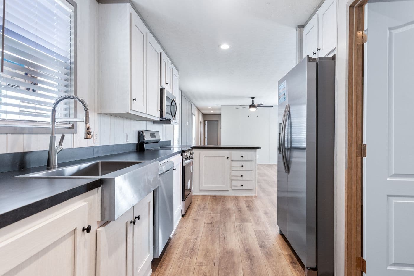 The RESOLUTION 16763K Kitchen. This Manufactured Mobile Home features 3 bedrooms and 2 baths.