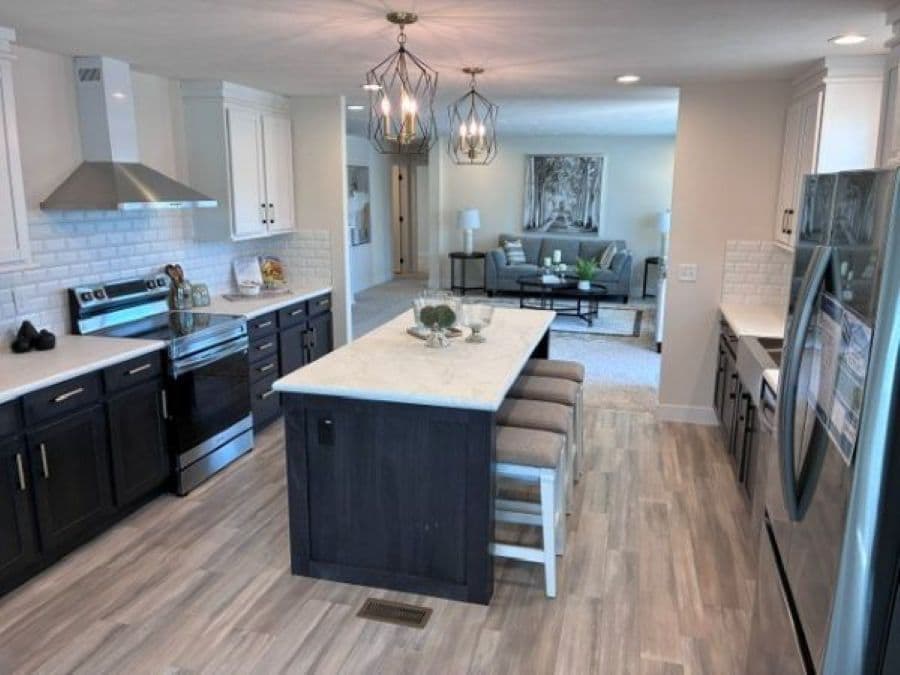 The PIONEER ST 6030-MS064 SECT Kitchen. This Manufactured Mobile Home features 3 bedrooms and 2 baths.