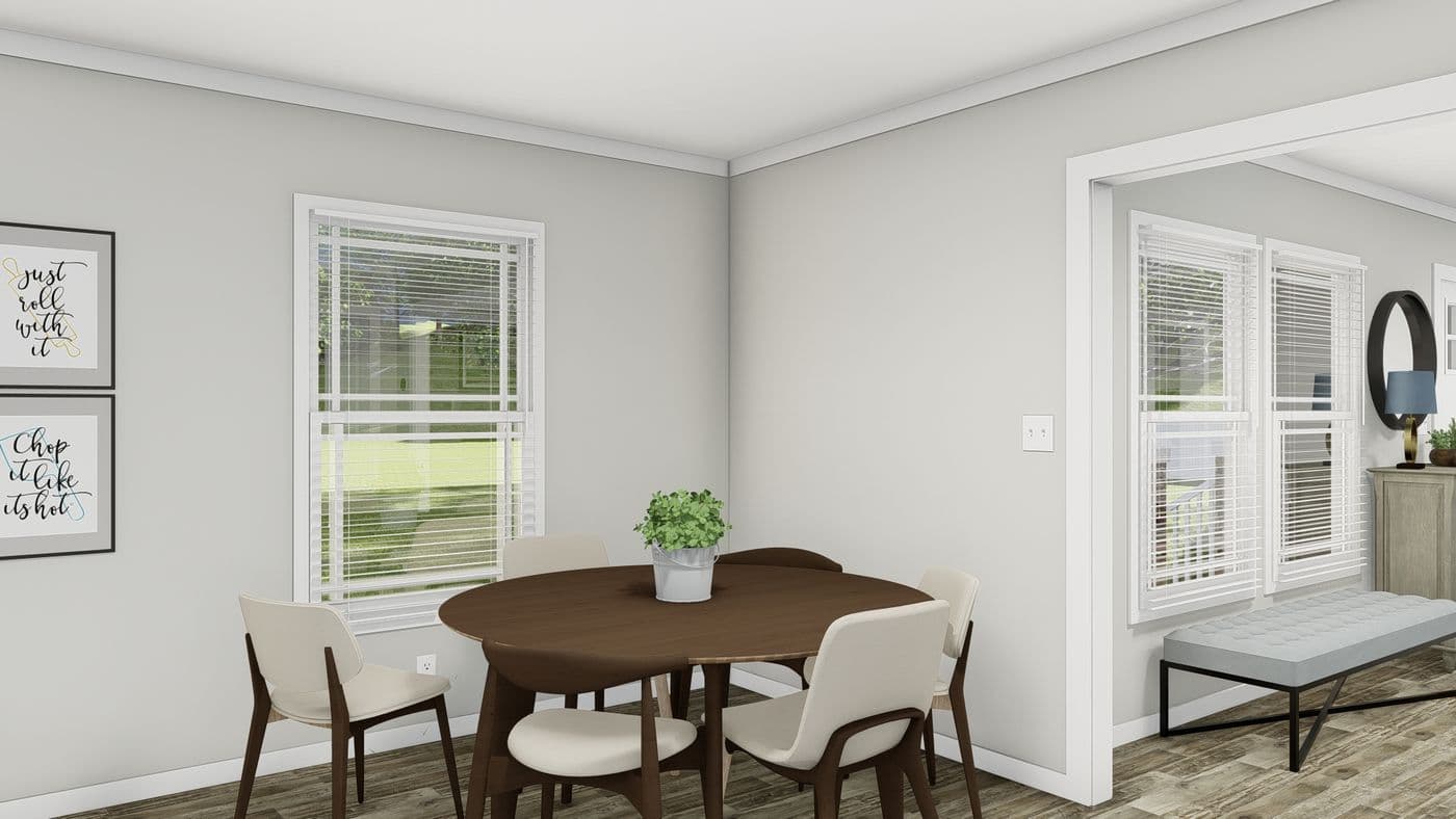 The FRONTIER Dining Area. This Manufactured Mobile Home features 3 bedrooms and 2 baths.