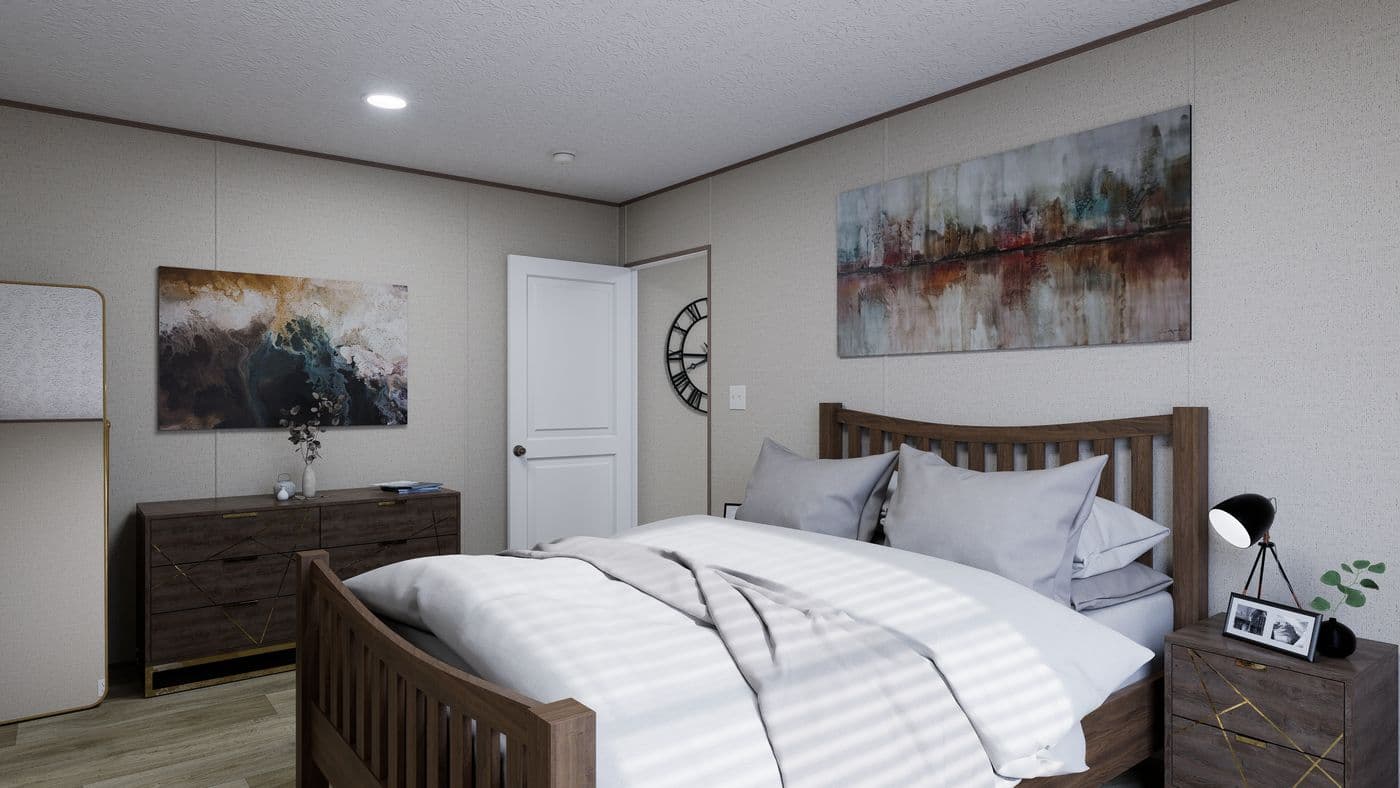 The FOOTHILLS 72 Primary Bedroom. This Manufactured Mobile Home features 3 bedrooms and 2 baths.