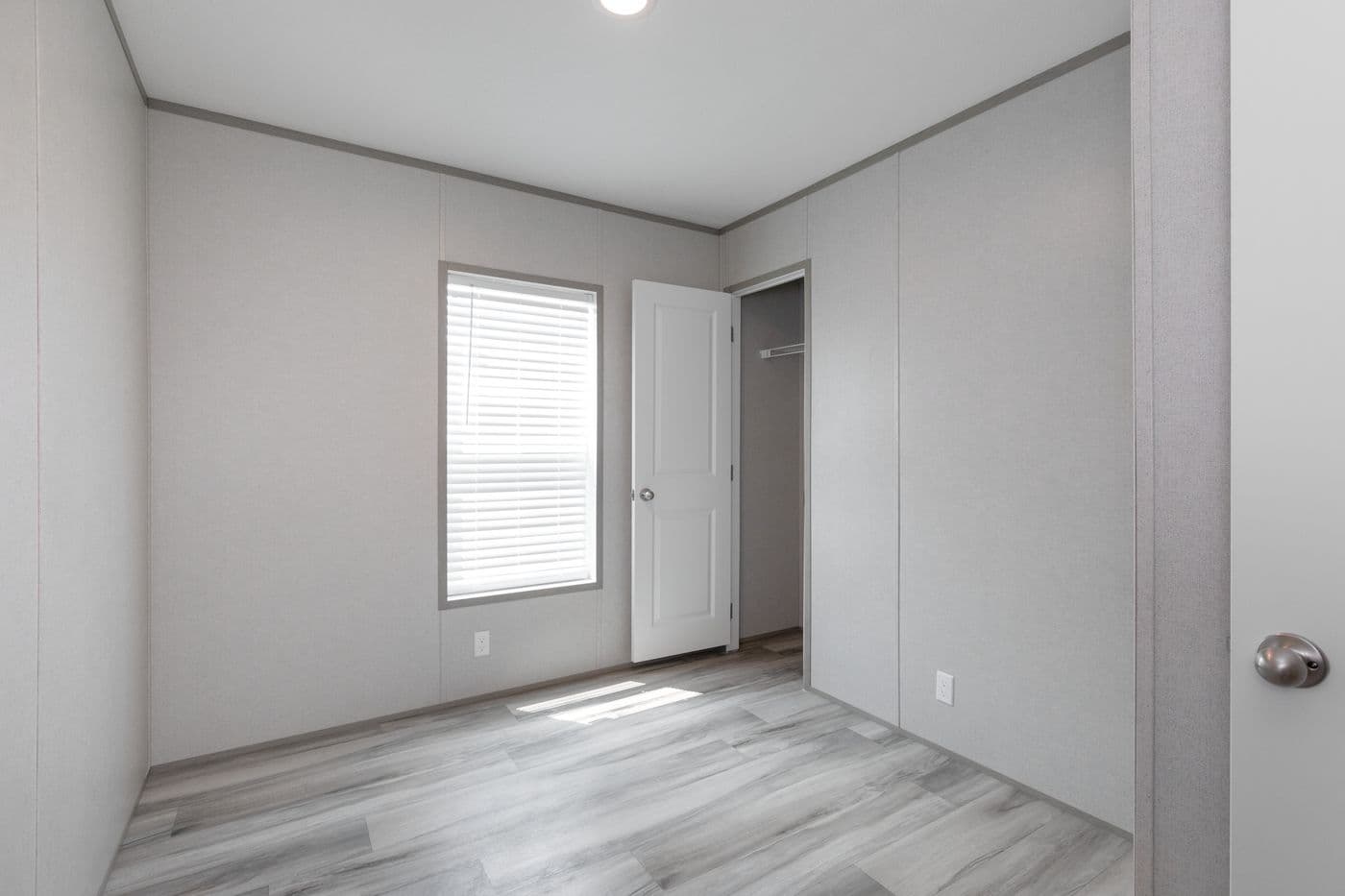 The THE ULTIMATE SHOWER Guest Bedroom. This Manufactured Mobile Home features 3 bedrooms and 2 baths.
