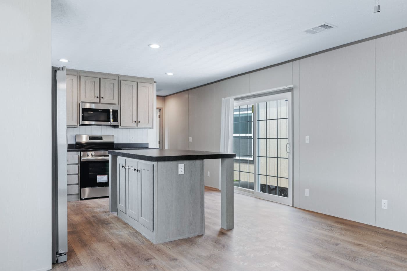 The RESOLUTION 16763H Kitchen. This Manufactured Mobile Home features 3 bedrooms and 2 baths.