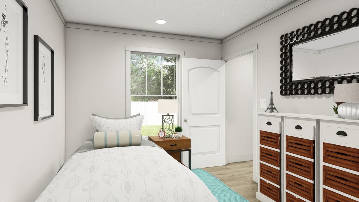 The SATISFACTION Guest Bedroom. This Manufactured Mobile Home features 2 bedrooms and 1 bath.
