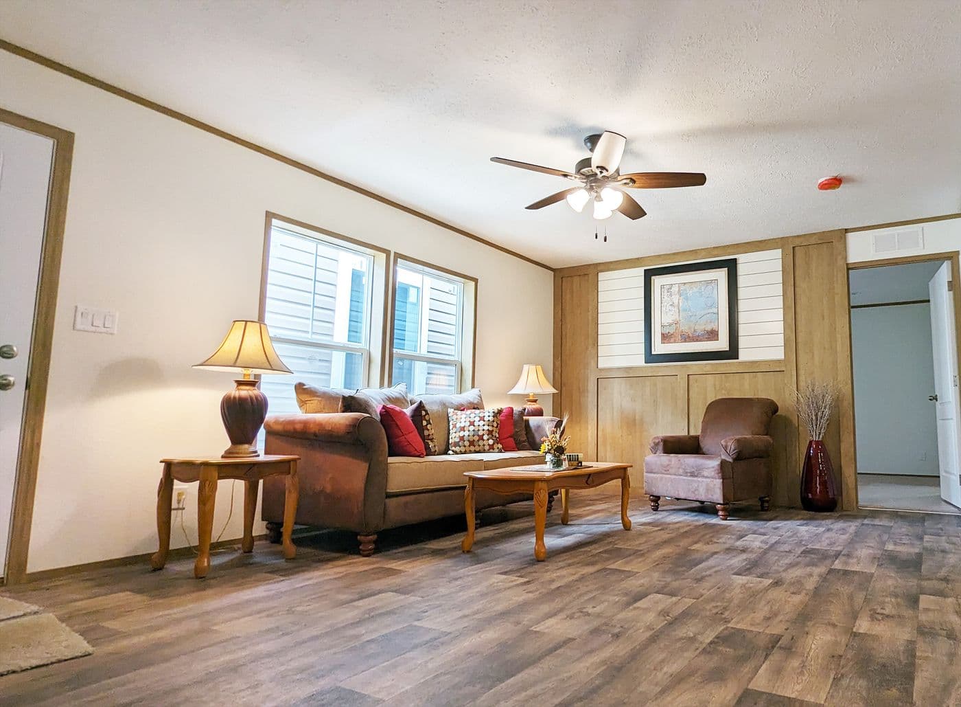 The LIFESTYLE 65-2 Living Room. This Manufactured Mobile Home features 3 bedrooms and 2 baths.