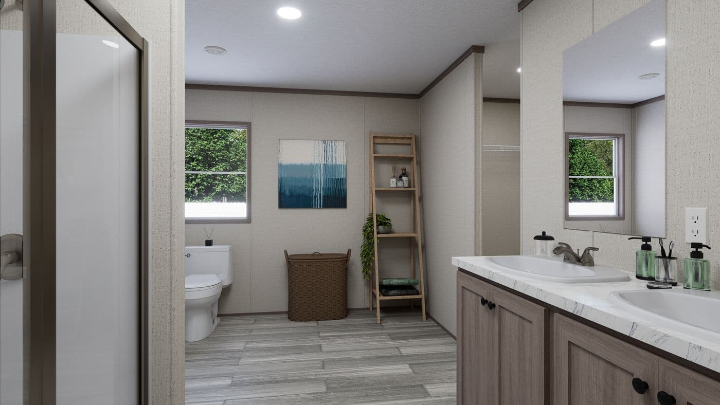 The THE MOUNTAINEER 60 Primary Bathroom. This Manufactured Mobile Home features 3 bedrooms and 2 baths.