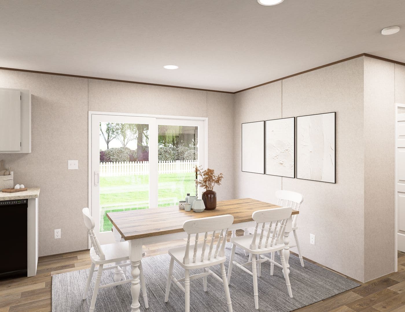 The SPRUCE Dining Room. This Manufactured Mobile Home features 3 bedrooms and 2 baths.