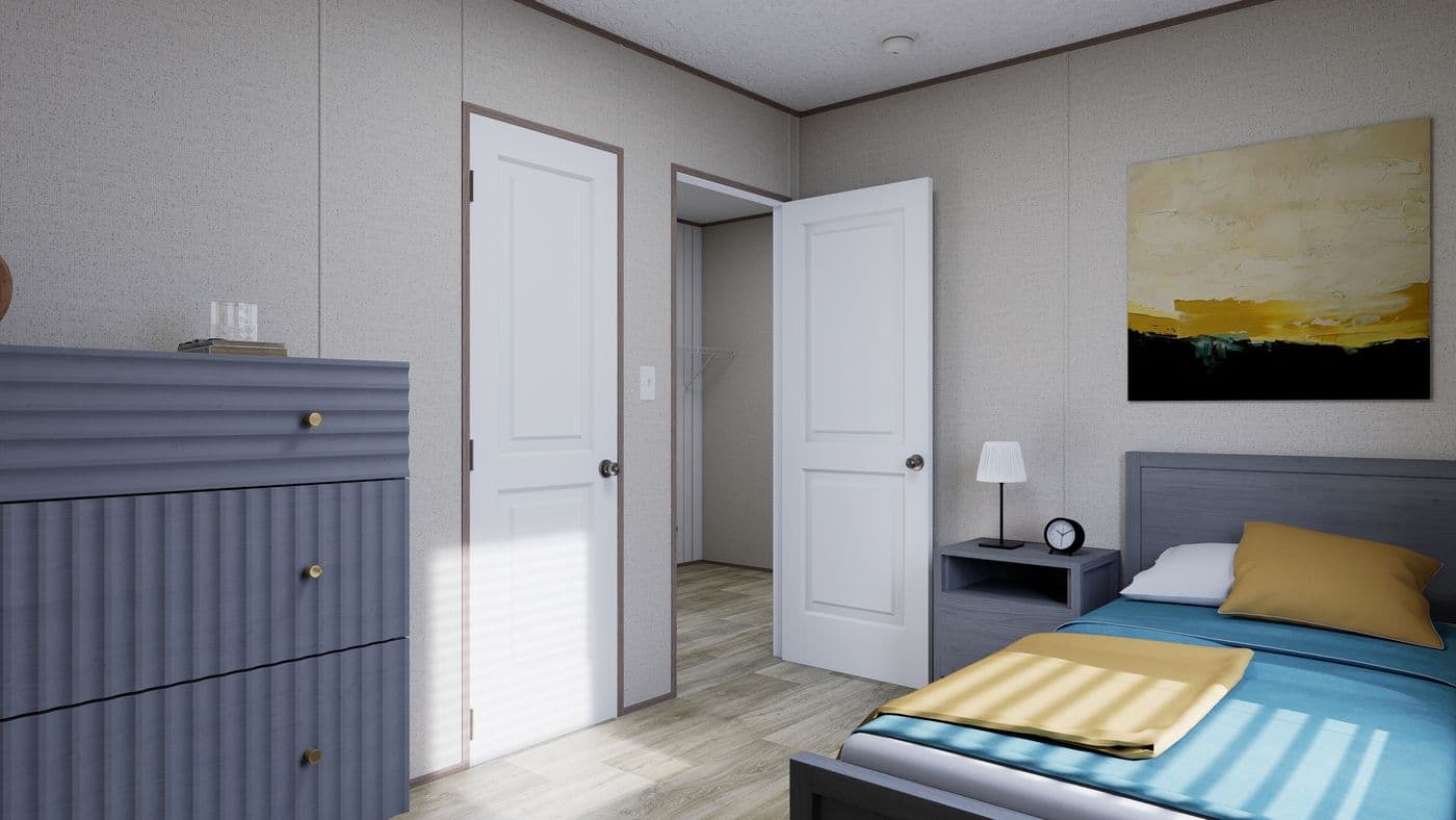 The FOOTHILLS 66 Guest Bedroom. This Manufactured Mobile Home features 3 bedrooms and 2 baths.