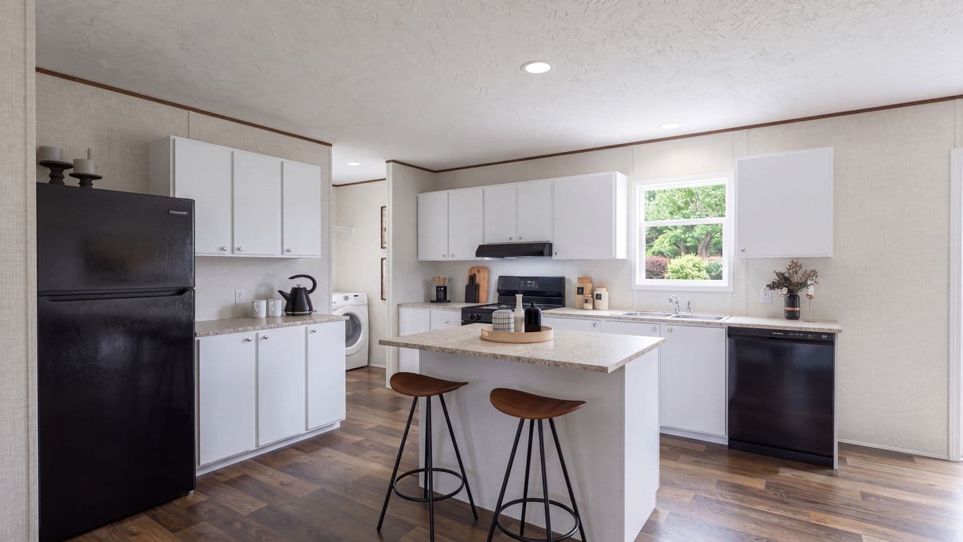The SPRUCE Kitchen. This Manufactured Mobile Home features 3 bedrooms and 2 baths.