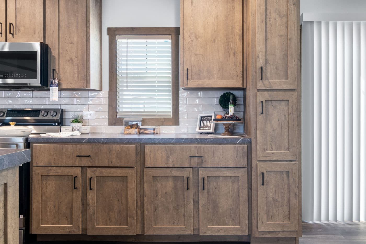 The ISABELLA ELITE Living Room. This Manufactured Mobile Home features 3 bedrooms and 2 baths.