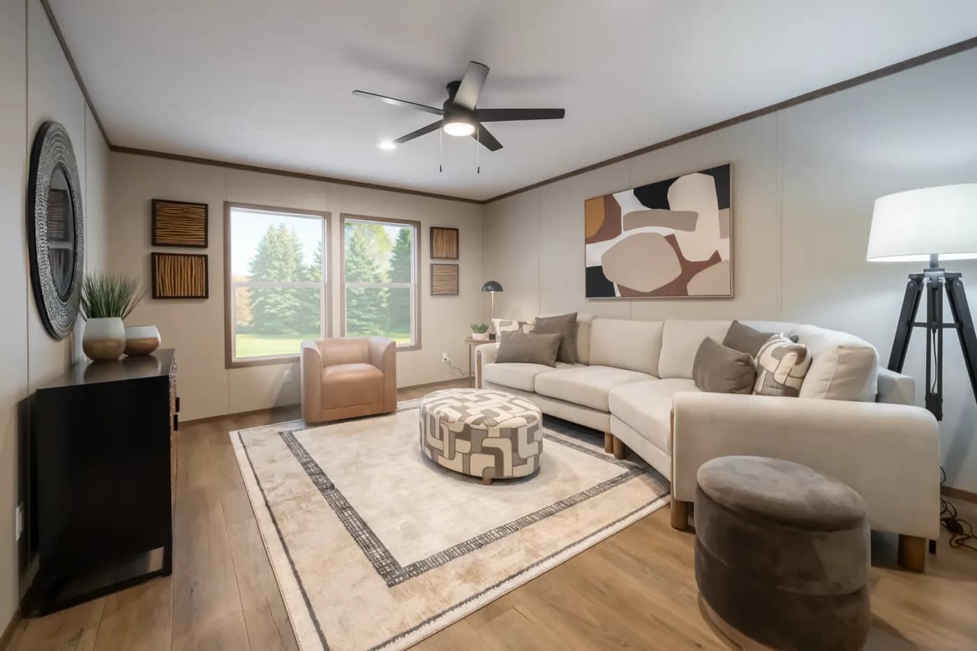 The SEVIER Living Room. This Manufactured Mobile Home features 4 bedrooms and 3 baths.