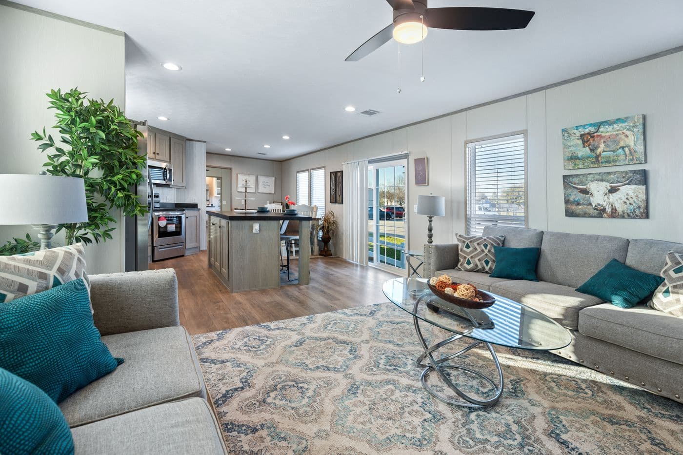 The RESOLUTION 16763J Living Room. This Manufactured Mobile Home features 3 bedrooms and 2 baths.