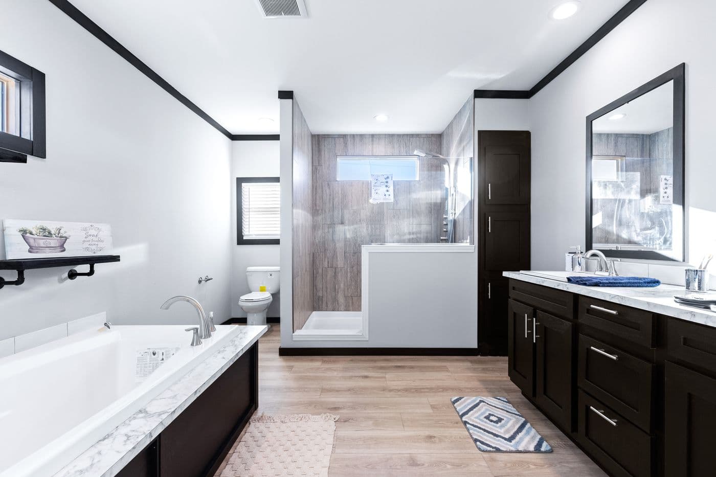 The THE LOUIS Primary Bathroom. This Manufactured Mobile Home features 4 bedrooms and 3 baths.