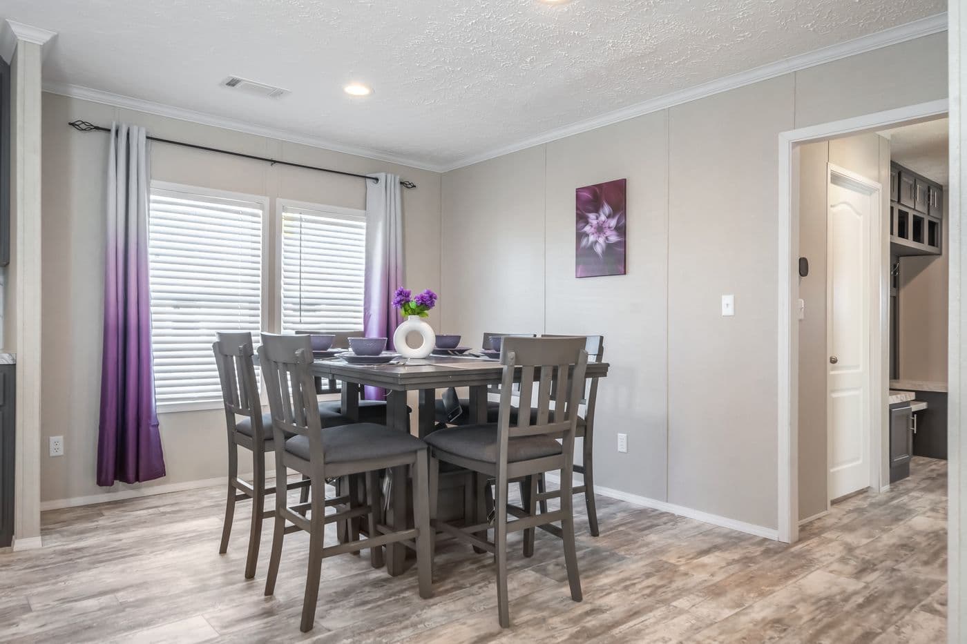 The STELLA Dining Room. This Manufactured Mobile Home features 3 bedrooms and 2 baths.