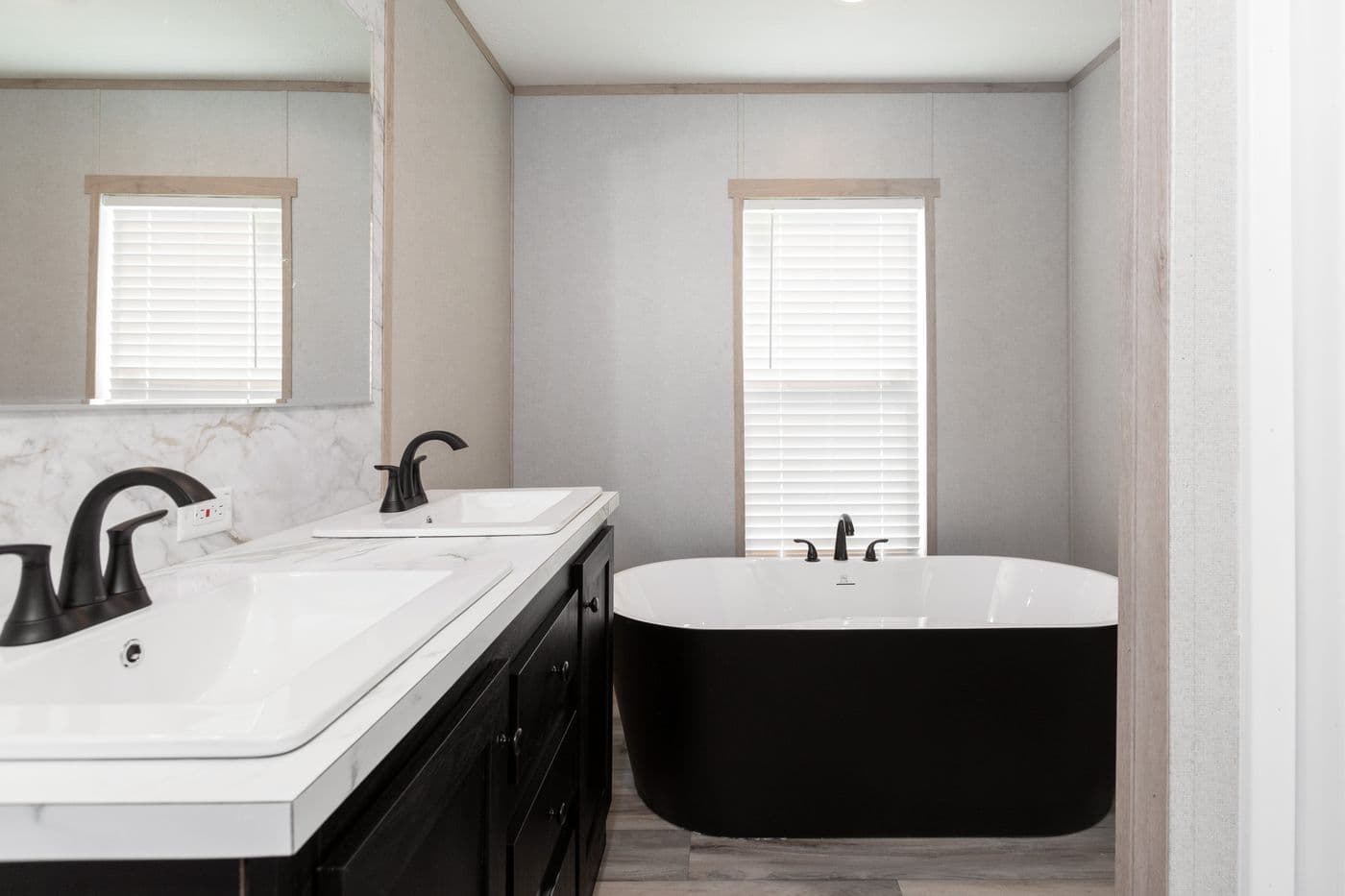 The THE ANNIVERSARY ISLANDER Primary Bathroom. This Manufactured Mobile Home features 3 bedrooms and 2 baths.
