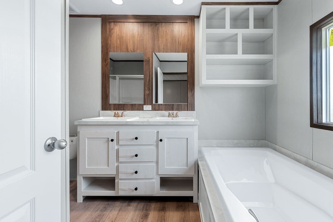 The ANNIVERSARY 16683B Primary Bathroom. This Manufactured Mobile Home features 3 bedrooms and 2 baths.