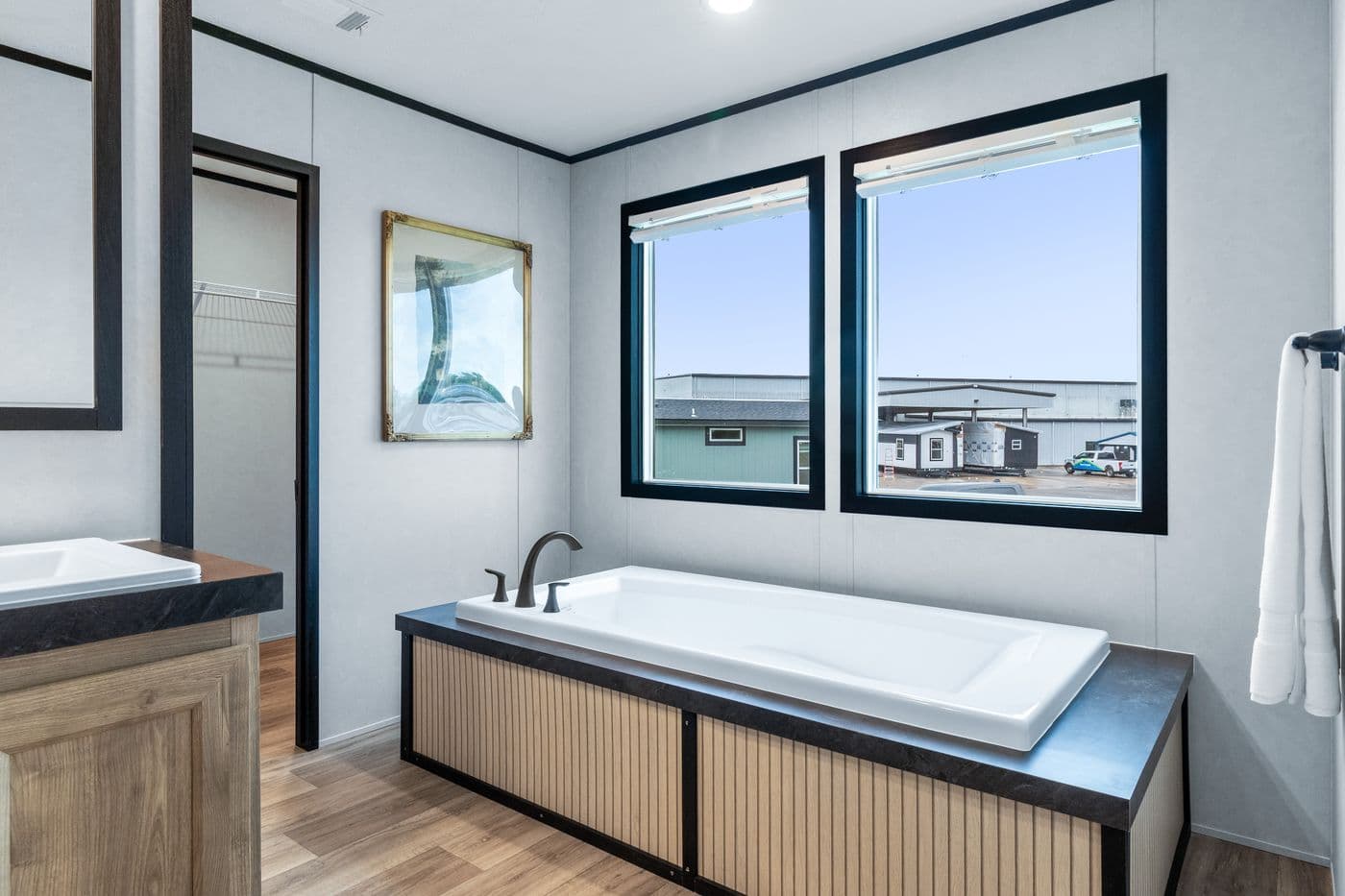 The ODYSSEY Primary Bathroom. This Manufactured Mobile Home features 4 bedrooms and 2 baths.