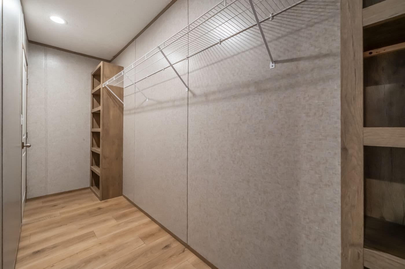 The WARRIOR II Primary Bedroom. This Manufactured Mobile Home features 2 bedrooms and 2 baths.