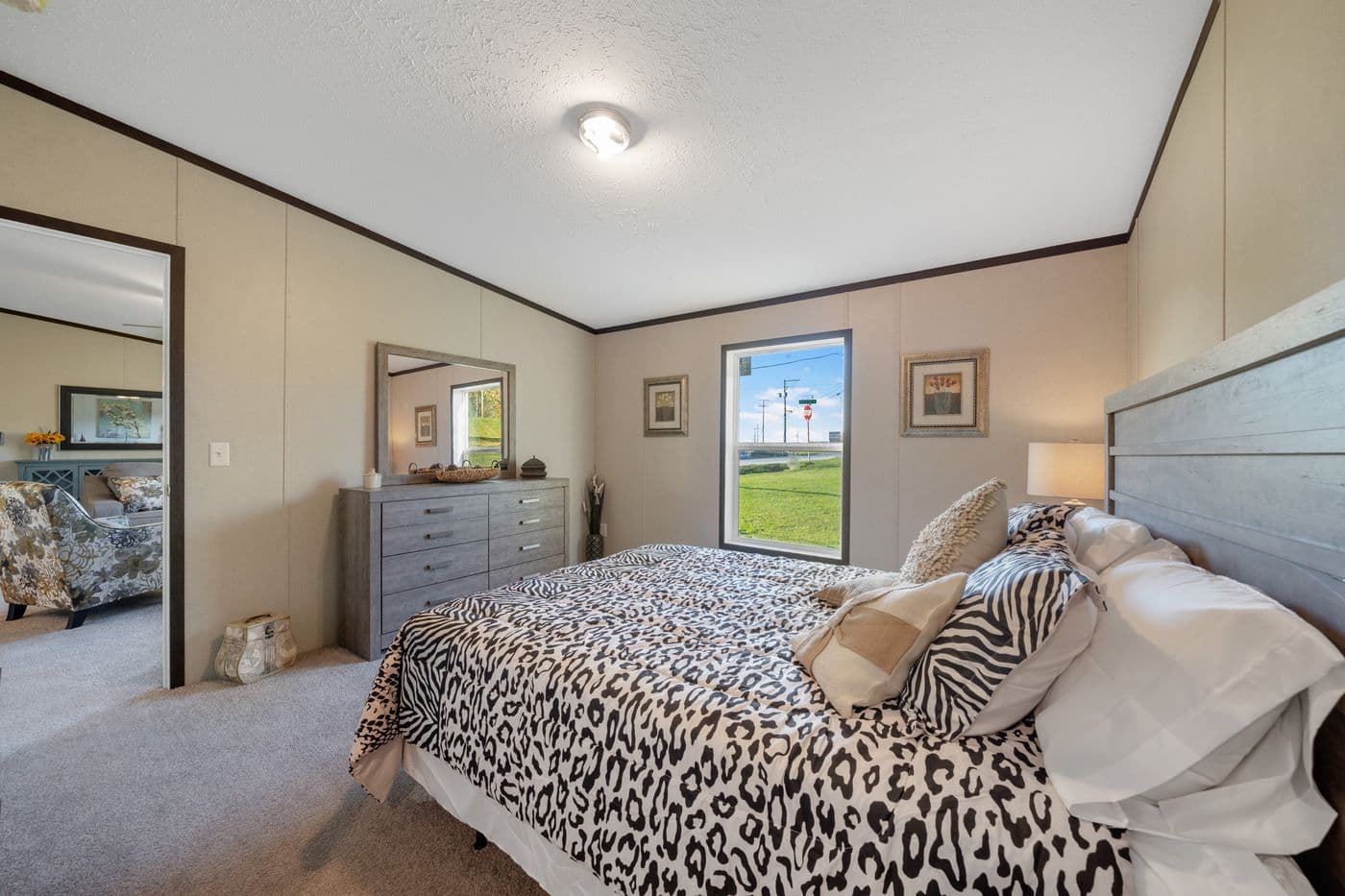 The GARNET Primary Bedroom. This Manufactured Mobile Home features 3 bedrooms and 2 baths.