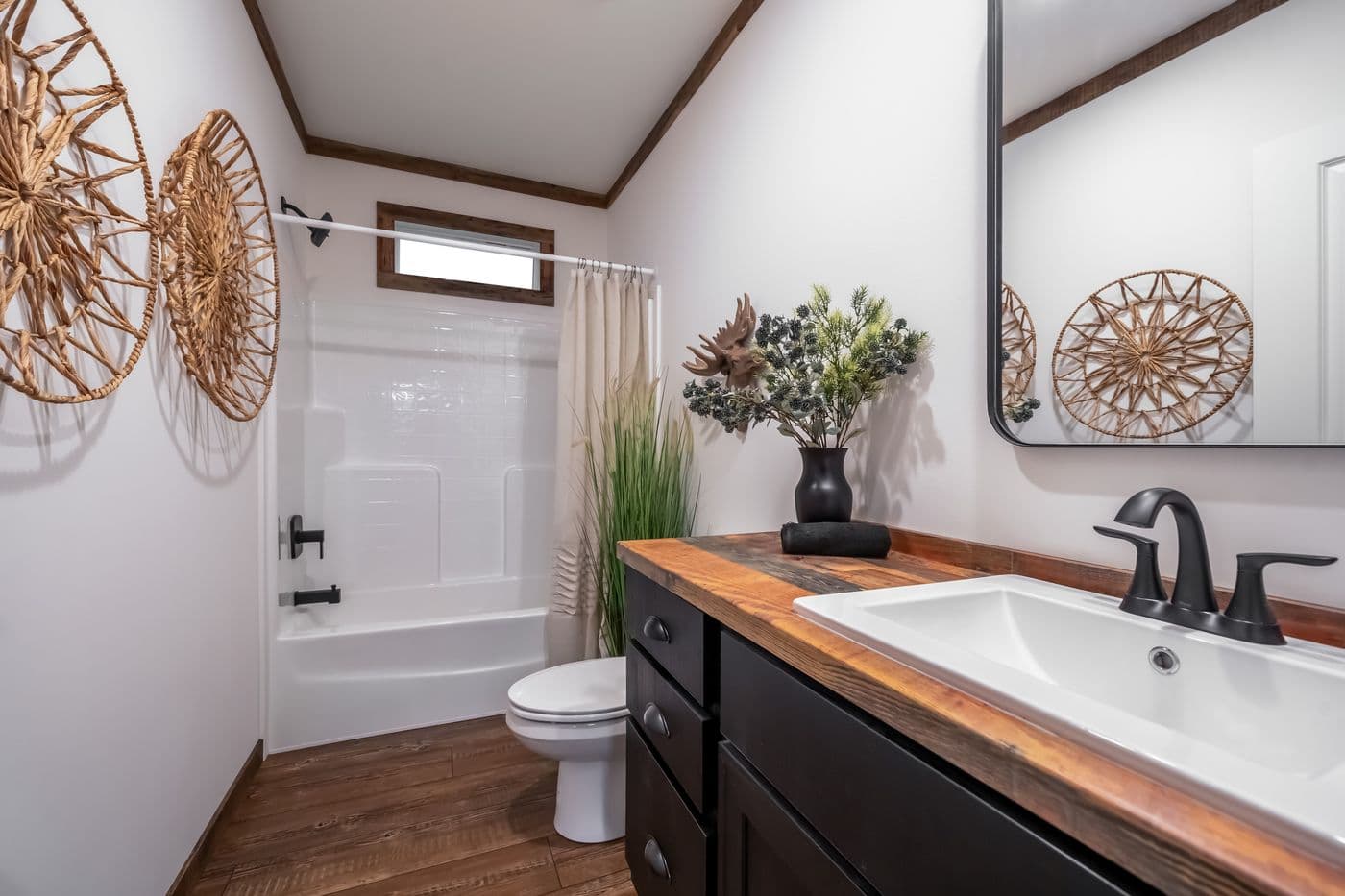The THE MILL HOUSE Primary Bathroom. This Manufactured Mobile Home features 3 bedrooms and 2 baths.