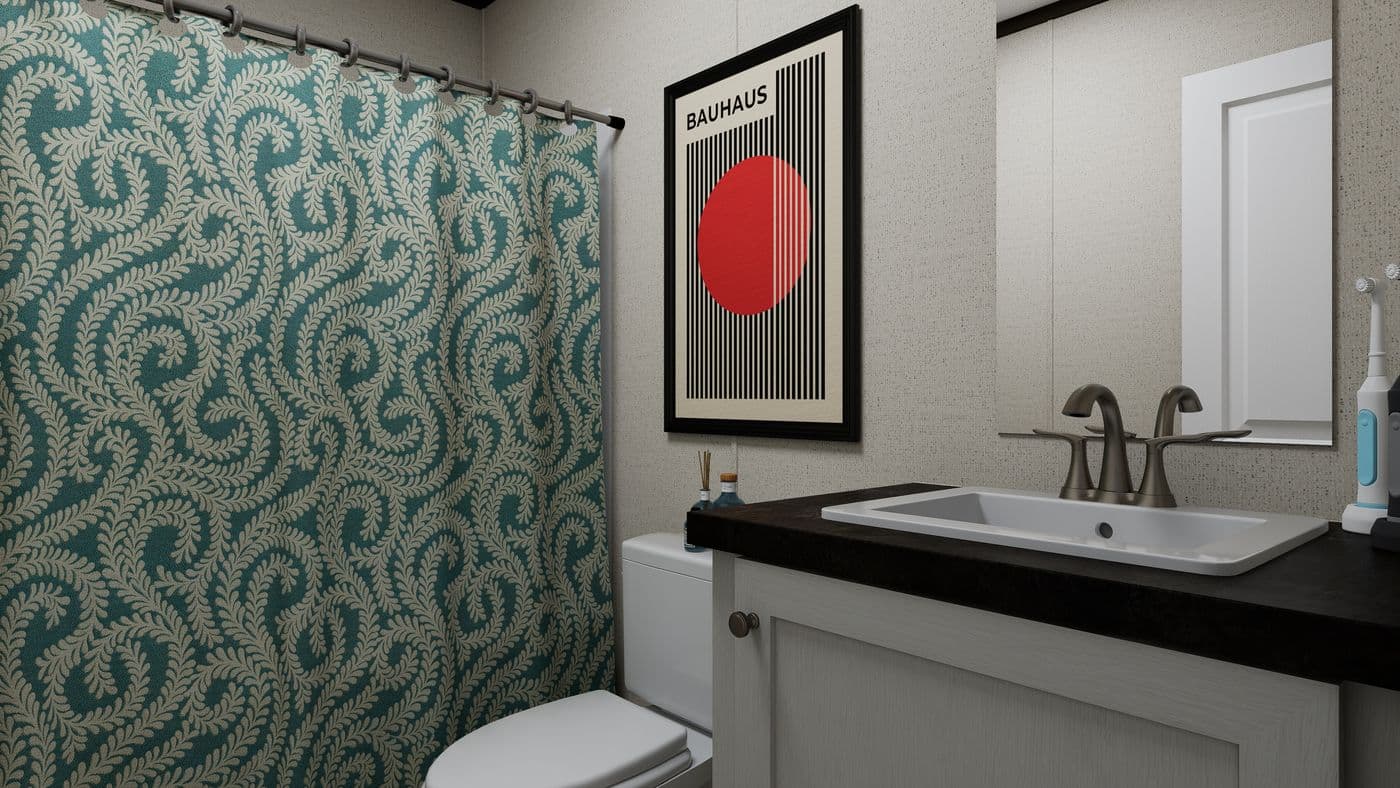 The THE SPARK Guest Bathroom. This Manufactured Mobile Home features 3 bedrooms and 2 baths.
