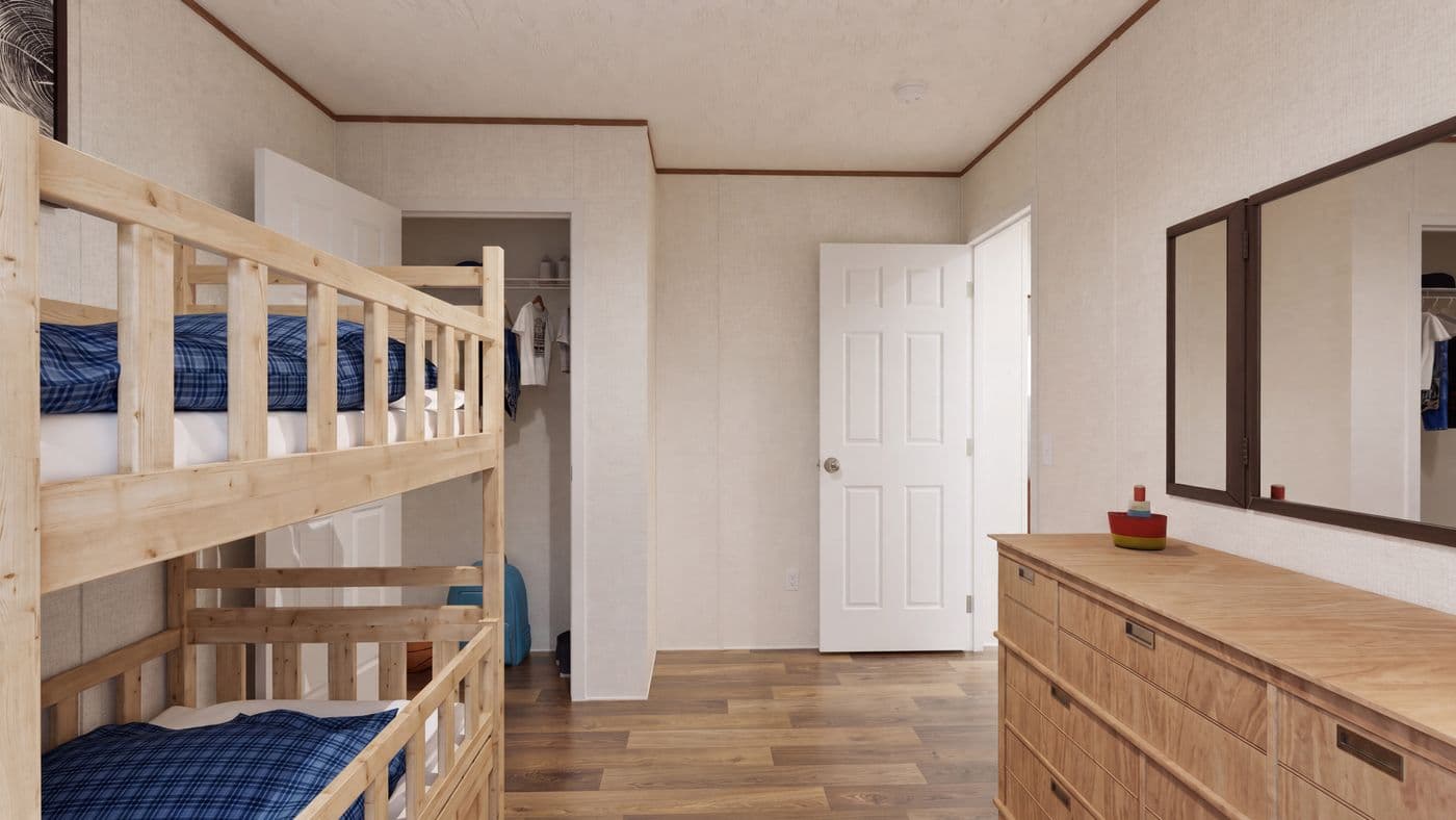 The CEDAR Guest Bedroom. This Manufactured Mobile Home features 3 bedrooms and 2 baths.